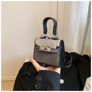 Mini denim kids handbag with black leather trim and silver metal twist lock detail
