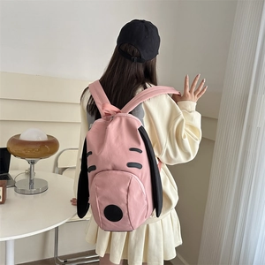 Pink cartoon dog backpack for students featuring cute floppy black ears and large capacity