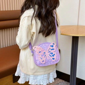 Purple sequin crossbody bag for girls featuring a large 3D butterfly and adjustable strap