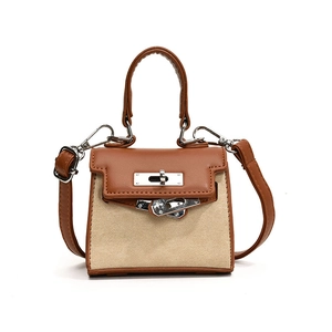 Mini children's leather handbag with canvas contrast and silver metal clasp