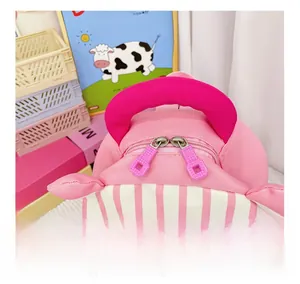 Detail of pink strawberry backpack showing smooth double zippers and wide top handle