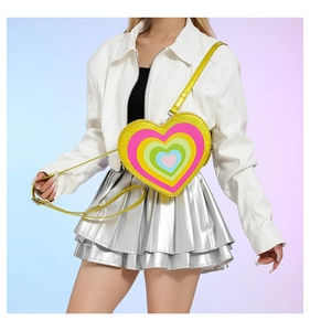 Detail of glitter heart crossbody bag with colorful rainbow concentric patterns