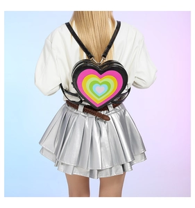 Fashionable heart-shaped backpack with colorful gradient pattern shown on a female model