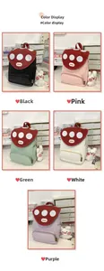 Flat lay of mushroom backpacks in five colors including black, pink, green, white and purple