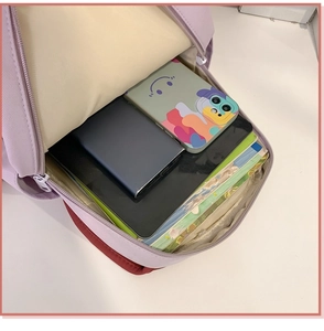 Top view of lavender backpack interior showing spacious capacity for tablets and books