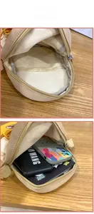 Aperçu de la capacité du sac bandoulière en toile poussin mignon avec compartiment ouvert