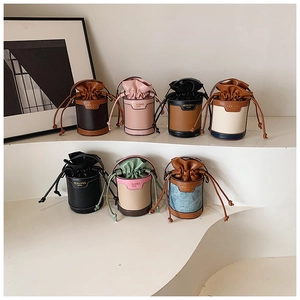 Collection of stylish mini bucket bags in various colors with elegant drawstring closures