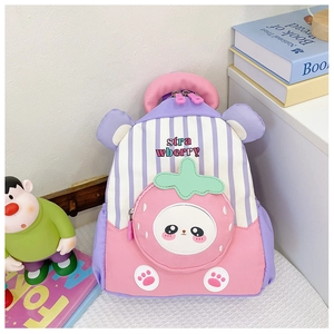 Detail view of pink and purple striped kids backpack with cartoon strawberry pattern
