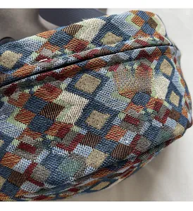 Detail of colorful geometric jacquard canvas fabric and zipper on this vintage crossbody bag