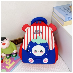 Detailed view of the strawberry cartoon pocket and durable striped fabric on a kids backpack