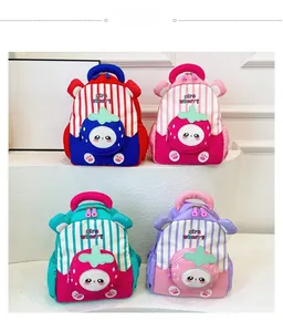 Four colorful kids backpacks with strawberry patterns and bear ears displayed on a stand