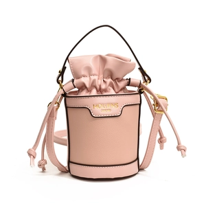 Pink bucket drawstring crossbody bag for kids with gold logo and adjustable strap