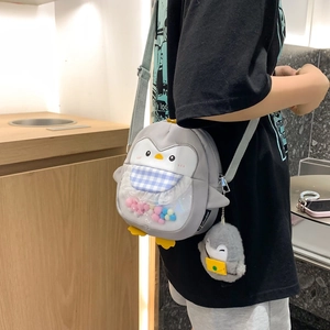 Cute gray penguin crossbody bag with colorful plush balls in a clear PVC pocket