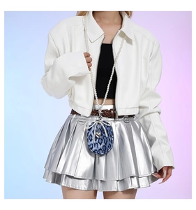 Blue leopard print crossbody bag with pearl strap and bow detail shown on a model