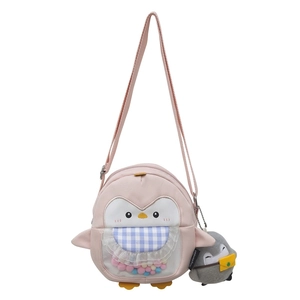 Cute pink penguin crossbody bag for girls featuring colorful fur balls and plush charm