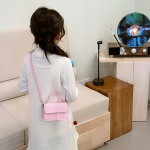Sac à main enfant rose en cuir PU avec texture épissée et poignée sur le dessus