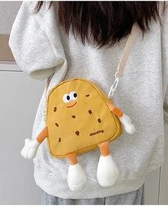 Detail showing the cartoon cookie crossbody bag with 3D limbs and douding embroidery