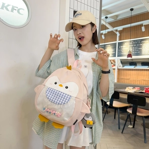 Cute pink penguin backpack with colorful pompoms and matching charm for girls