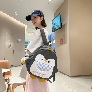 Cute gray penguin backpack with blue plaid pocket and yellow flipper details for students