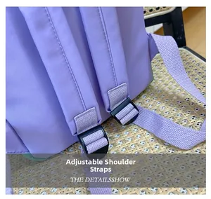 Detail view of thickened adjustable shoulder straps and black plastic buckle on kids backpack