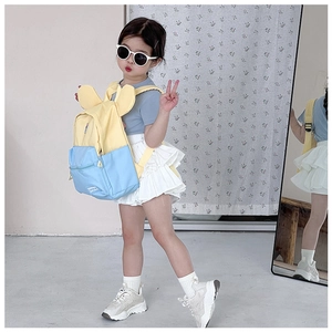 Detail view of colorful kids backpack with cute ears showing side and front wear