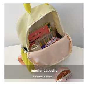 Detailed interior view of a color-block kids backpack showing large storage capacity