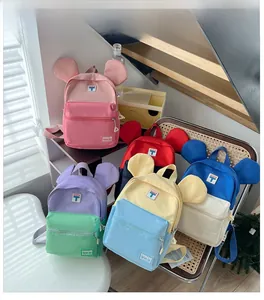 Detailed collection of colorful children backpacks with cute 3D ears and front zippers