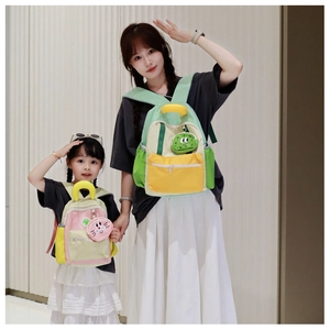 Detailed view of canvas color-block backpacks for kids with cute animal pendant