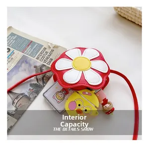 Detail view of flower-shaped crossbody bag interior showing storage for small accessories