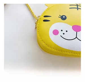 Close-up of yellow bunny shoulder bag showing quality stitching and metal zipper details