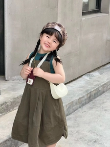 Kids vintage outfit styled with a minimalist white crescent moon shoulder bag