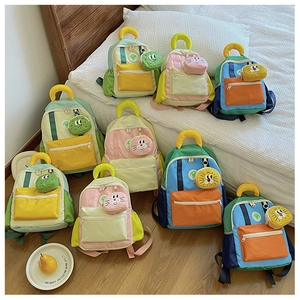 Kids color-block canvas backpack detail with cute animal pouches in vibrant home setting