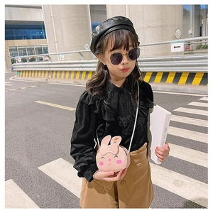 Toddler girl wearing pink bunny crossbody bag with bow detail and cartoon ears decor