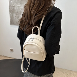 Cream-colored minimalist mini backpack for kids in high-quality smooth synthetic leather