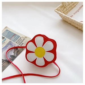 Detail of red flower-shaped kids crossbody bag with white petals and yellow center