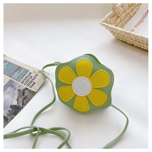 Detail showing high-quality stitching on green daisy-shaped PU leather kids crossbody bag