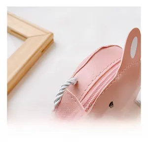 Close-up of pink rabbit crossbody bag showing fine PU leather texture and zipper details