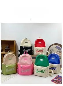 Detailed view showing six diverse color options for large capacity school backpacks