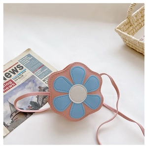 Detail of cute pink flower crossbody bag for girls with soft PU leather petals