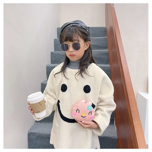 Detail of pink cartoon rabbit crossbody bag for kids with cute flower decorations