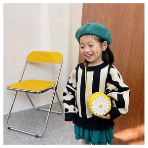 Kids round daisy shoulder bag styled with a striped sweater and green beret hat