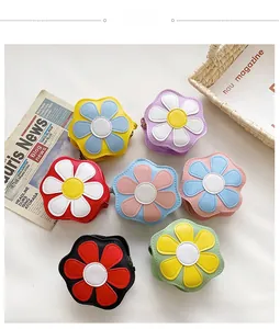 Detailed close-up of colorful flower-shaped PU leather coin purses with metal zippers