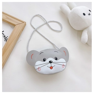 Detail of gray mouse-shaped kids crossbody bag with cartoon face on soft cream surface