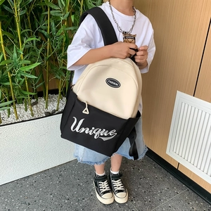 Minimalist black and white large capacity primary school backpack with letter embroidery