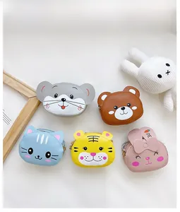 Close-up of five cute animal mini crossbody bags with gold zippers and carrot print