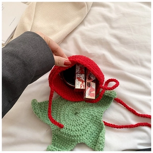 Detail showing the internal storage space of a handmade crochet star-shaped crossbody bag