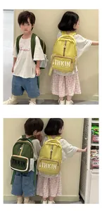 Detail view of large-capacity kids backpacks with letter print and side mesh pockets