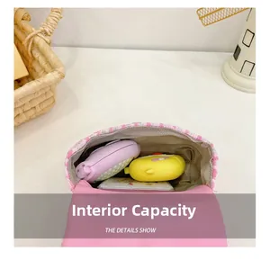 Macro view showing the internal storage capacity of the pink tweed crossbody girl bag