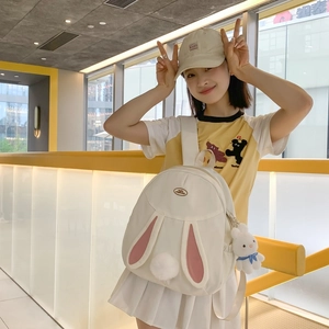Cute white bunny backpack with pink ears and plush charm for women in daily casual use