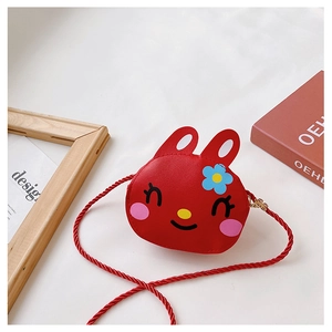Close-up of red PU leather rabbit crossbody bag with cute floral headwear and texture